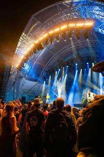 Crowd at a night concert in front of a blue illuminated stage, Klostersommer, Calw Hirsau, Black