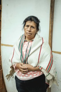 Portrait of a miner in her home, Cachapalca, Peru