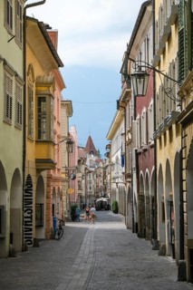 Merano, South Tyrol, Italy, A few passers-by stroll through the Laubengasse, the arcades are the