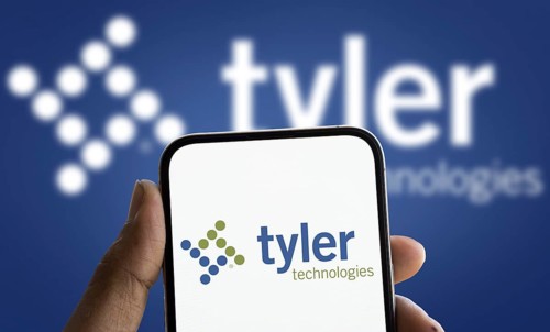 tyler technologies logo is displayed on smartphone. Tyler Technologies Inc is a provider of