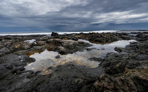 Tide pools, rocky coast with volcanic stones, Playa de la Pequeña, Punta Usaje, Lanzarote, Canary