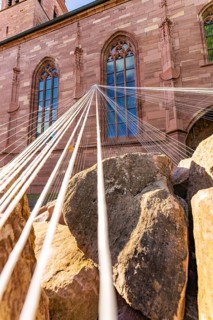 A Gothic church window with ropes in the foreground, emphasising architectural details, Weil der