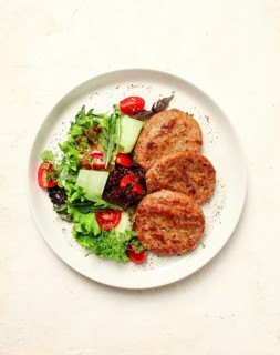 Fried cutlets, minced beef, with vegetable salad, top view, no people