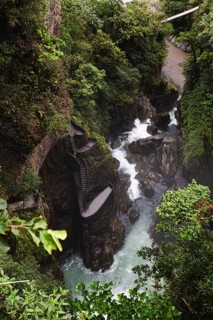 Spectacular view of a cascading waterfall surrounded by lush greenery near El Altar volcano,