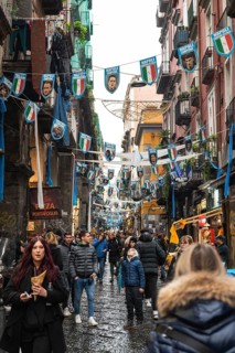 NAPLES, ITALY - JANUARY 14, 2024: A street with the pennants of the football team FC Napoli, the