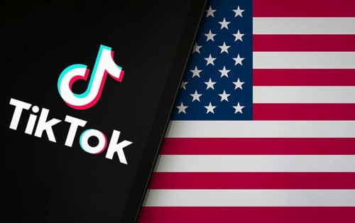 TikTok is preparing for a shutdown in the US. Tiktok logo is displayed on Ipad and USA flag in the