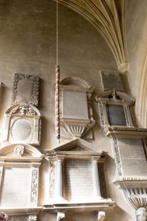 Wall mounted historic grave memorials Interior of church of Saint Bartholomew, Corsham, Wiltshire,