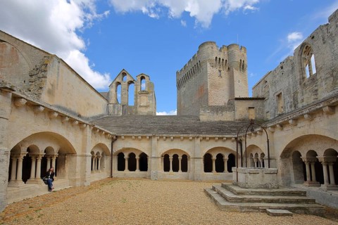 Courtyard with cloister and archways of the Romanesque monastery Abbaye de Montmajour, Benedictine