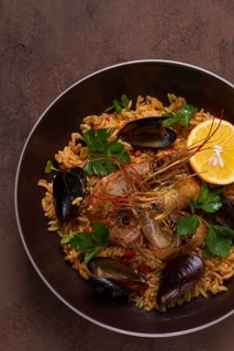 Seafood paella, shrimp and mussels risotto, rice, homemade, top view, no people