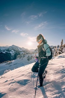 Hiking in the snow in the snow-covered winder landscape in the Alps at Neunerköpfle in the