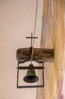 Bell in the cloister of the Basilica of Santa Caterina d'Alessandria, Franciscan church, Galatina,
