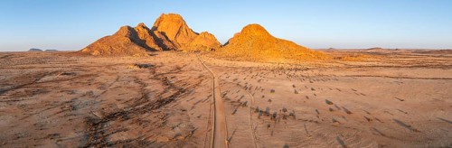 Aerial view, sunset, mountains in the desert, Spitzkoppe summit, Namib desert, Namibia