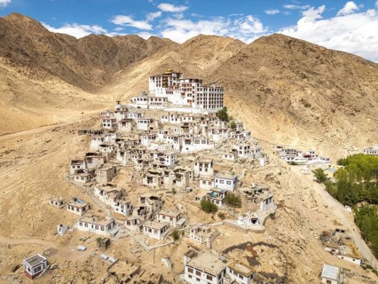 View of Chemrey Gompa, a picturesque monastery in Ladakh, India, nestled among the rugged mountains