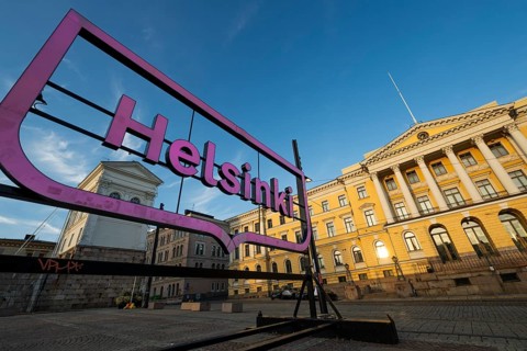 Large pink glowing city logo of Helsinki, Snellmaninkatu, city center, state government office,
