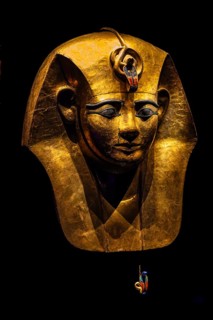 Gilded wooden mask from the coffin of Amenemope from the exhibition: Ramses the Great and the Gold
