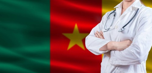 Doctor with crossed arms on Cameroon flag. Cameroonian health and care concept. Female doctor on