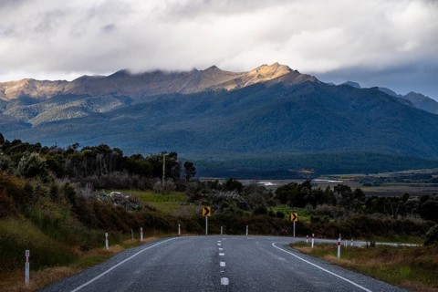Landscape with mountains and road, Milford Road between Te Anau and Milford Sound. Fiordland