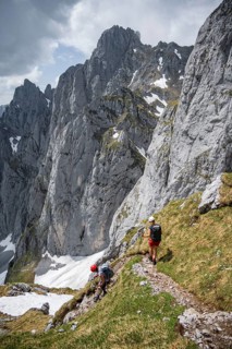Mountaineer with helmet on a hiking trail, Wilder Kaiser, Kaiser Mountains, Tyrol, Austria