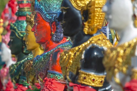 Thai style angel, graceful figures, in traditional golden clothing with ornate headdress, Thai
