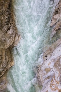 The Lammer creek is flowing fast through the Lammerklamm on a sunny hiking day
