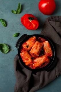 Stuffed cabbage rolls in tomato sauce stuffed cabbage leaves, minced meat with rice, on a dark