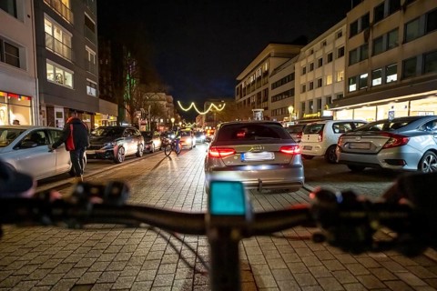 Cycling in the city, in the dark, in the evening, inner-city road, bicycle road, two-wheeler
