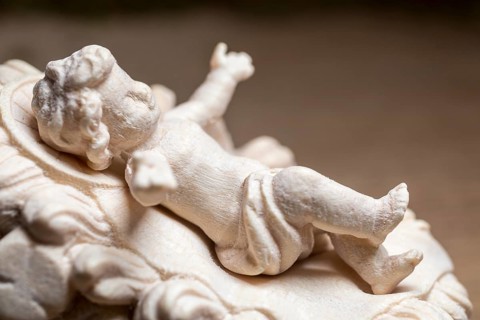 I'm standing at your crib here, wooden crib figure, the birth of Jesus Christ Child lying in a crib