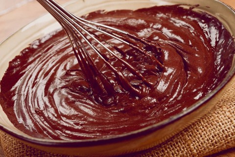 A bowl of chocolate dough, a whisk for whipping, baking, structure and consistency, homemade, top