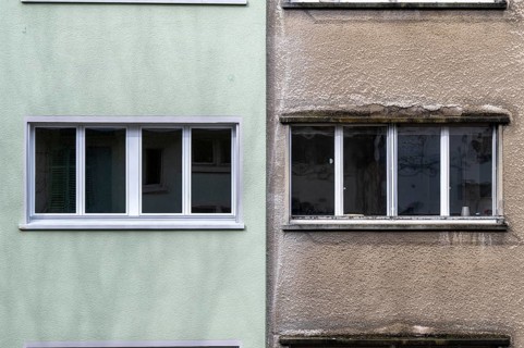 Windows, gray house facades, a house is renovated, renovation, modernization, contrast, difference,