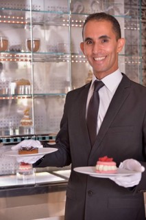 Waiter serving pastry at the Royal Mansour Hotel, Marrakesh, Marrakesh-Tensift-El Haouz region,