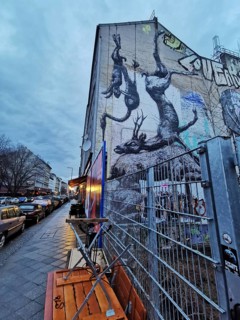 Urban evening with large murals and urban flair, Berlin