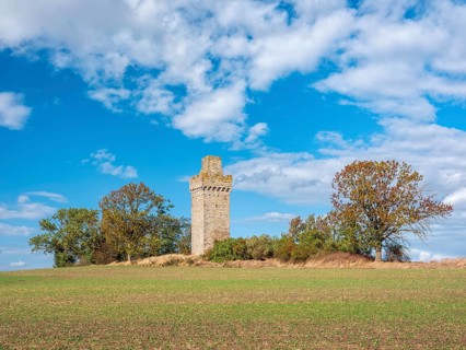 The lake houses waiting in a field in autumn, medieval watchtower in the Magdeburger Börde,
