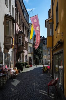 Picturesque old town alleyway with a row of shops in the old town of Lindau, Bavaria, Germany