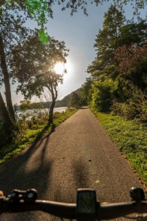 Cycling on Lake Baldeney, around 14 kilometres around the Ruhr reservoir, summer evening on the