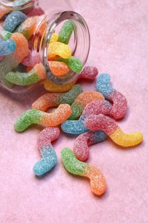 Lots of colorful jelly sweets with glass containers