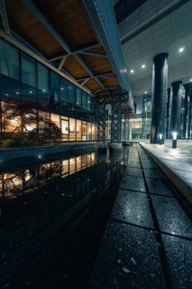 Modern architecture with water reflection and lights at night, Stuttgart, Germany