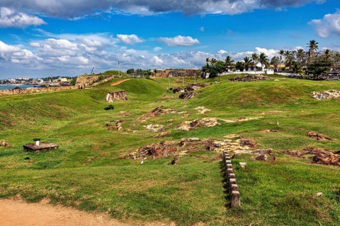 Green landscape with historic charm under cloudy skies, The fortress of Galle in Sri Lanka