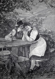 A young couple sits confidently at an outdoor table under a blooming blackthorn, with the young man