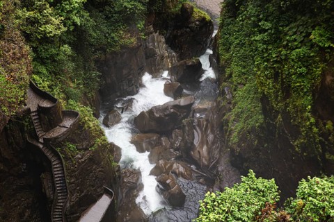 Spectacular view of a cascading waterfall surrounded by lush greenery near El Altar volcano,