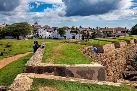 Historic walls overlooking a city and cloudy sky, The fortress of Galle in Sri Lanka