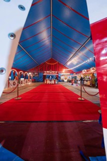 Entrance to a circus tent with red carpet and blue ceiling, festively decorated, Böblingen, Germany