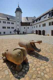 Inner courtyard with wooden sculptures from Wildeck Castle, two, crocodile figure, mouth, open,