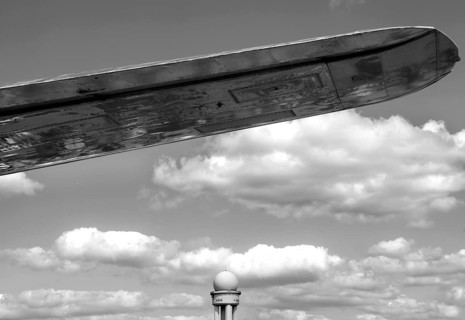 The wing of an airplane and a radar tower at Berlin Tempelhof Airport, Berlin, Germany