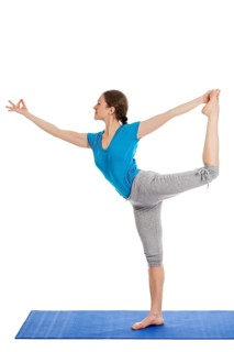 Yoga, young beautiful slender woman yoga instructor doing Lord of the Dance Pose (Natarajasana)