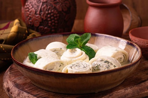 Gebjalia, a traditional Georgian dish, cold appetizer of cheese with mint, Megrelian cuisine, on a
