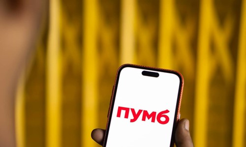First Ukrainian International Bank logo is displayed on smartphone