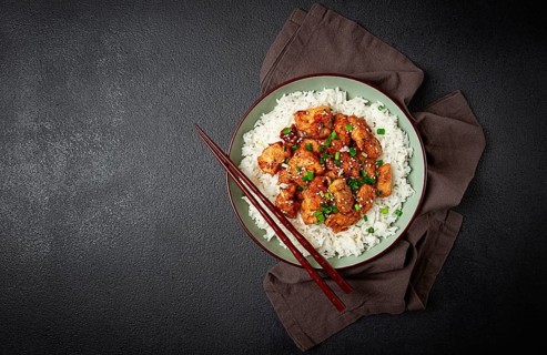 Fried chicken teriyaki with rice, green onion and sesame, homemade, no people