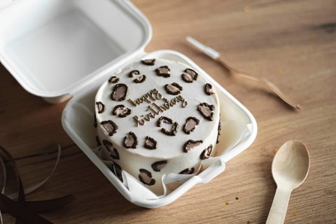 South Korean bento birthday cake featuring Happy Birthday written with chocolate decorations,