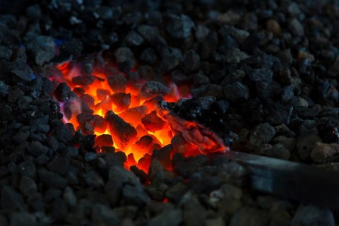 A blacksmith forging, working at the Ehnert forge in Dresden-Bühlau, Saxony, Germany