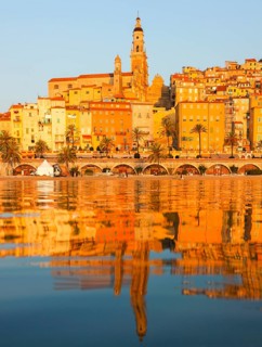 The town of Menton reflected in the sea, Menton, Côte d'Azur, Provence, France